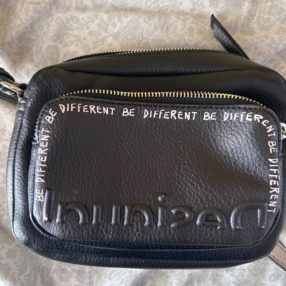 Desigual black crossbody soft leather material with “be different” messaging